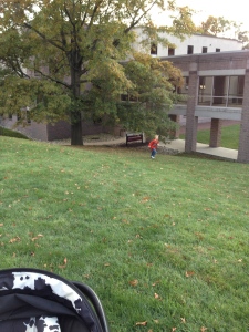 Max running up the hill outside his music program.