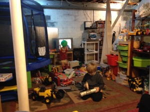 The boys playing in the basement.