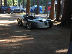 Cool... car... bike... something, next door at a cabin. 