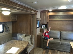 The opposite view that is a murphy bed behind Max. 