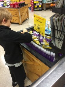 Max lining up hand sanitizer. 