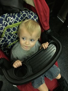 Nathaniel on the subway. Later he went on the subway with the iPad and watched videos.