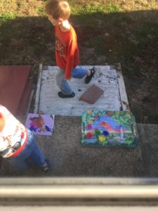 Bad photo but Nathaniel painting with paint and syringes (it was doctor day with Mother Goose Time). 
